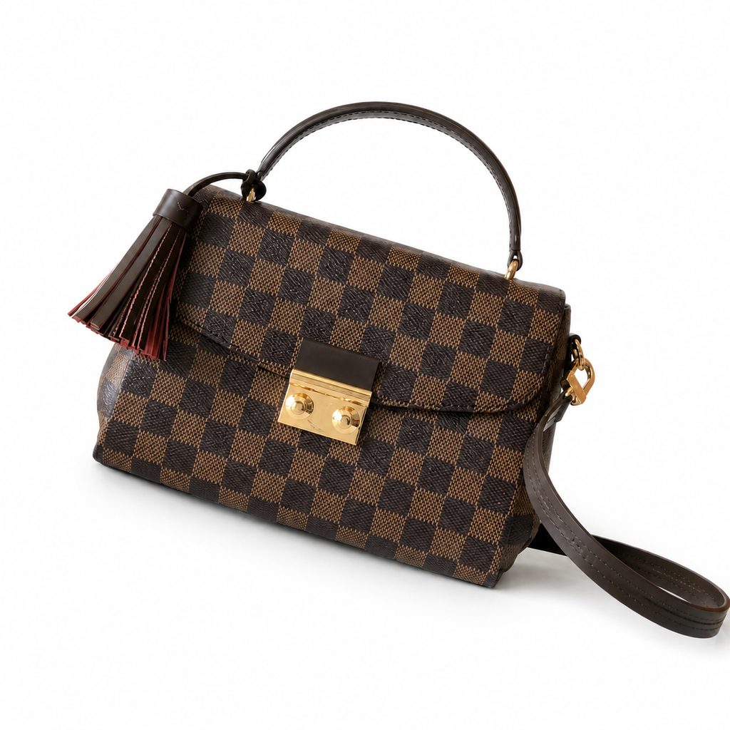 Louis Vuitton Croisette top-handle bag in Damier Ebene canvas with gold turn-lock closure and leather tassel charm