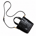 Saint Laurent YSL mini croc embossed top handle crossbody bag in black patent leather with gold hardware and adjustable strap