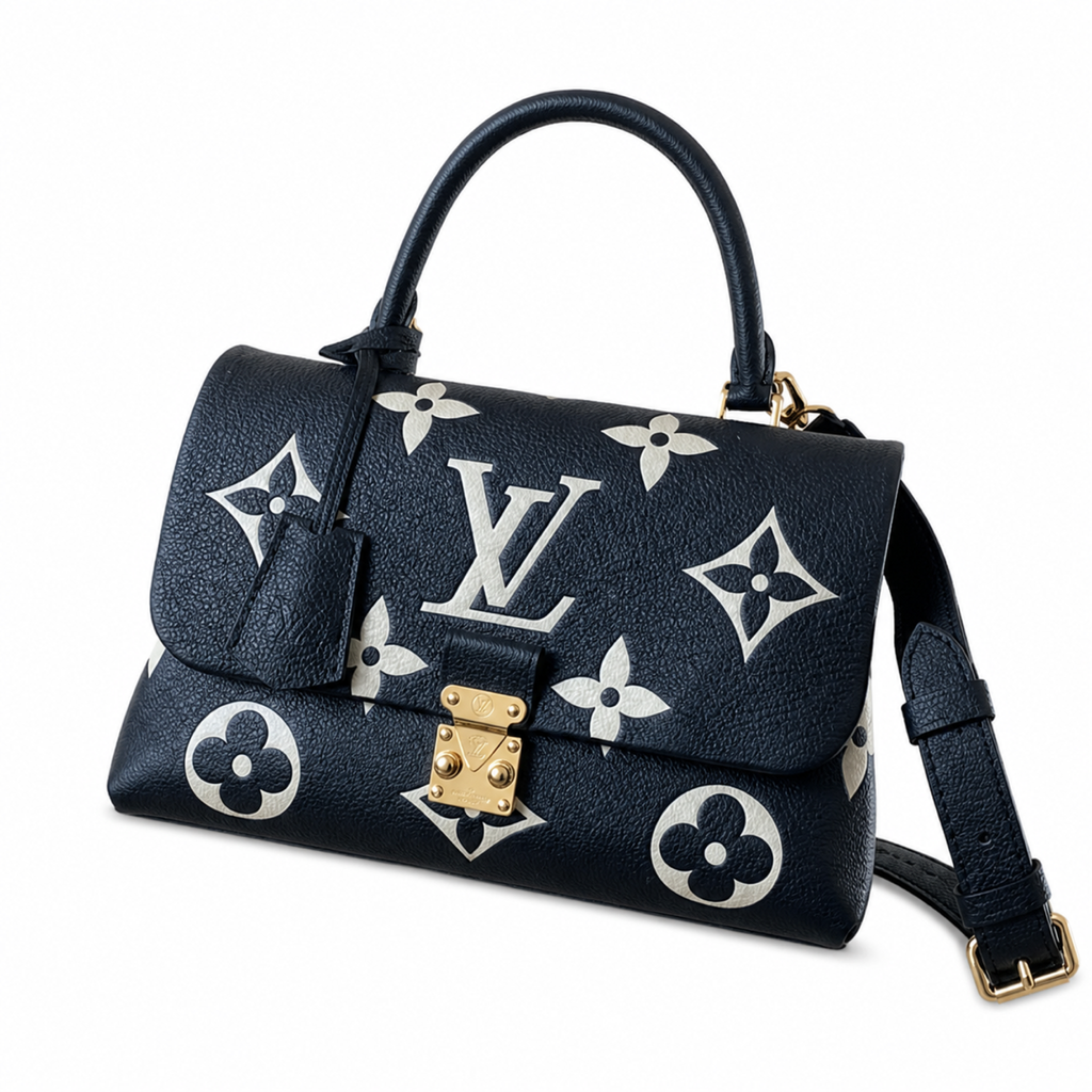Louis Vuitton Madeleine BB in black and white Monogram Empreinte leather with gold push-lock clasp