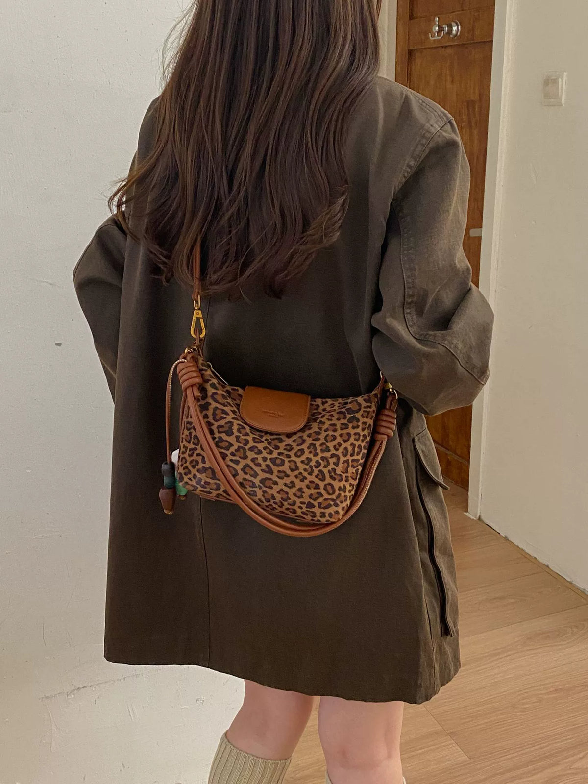 Leopard Print Canvas Hobo Crossbody Bag with Cognac Brown Leather Trim Front Flap Logo and Knotted Leather Adjustable Strap